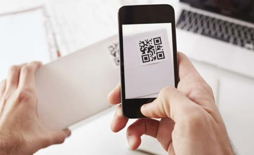 Man taking a photo of a screenshot